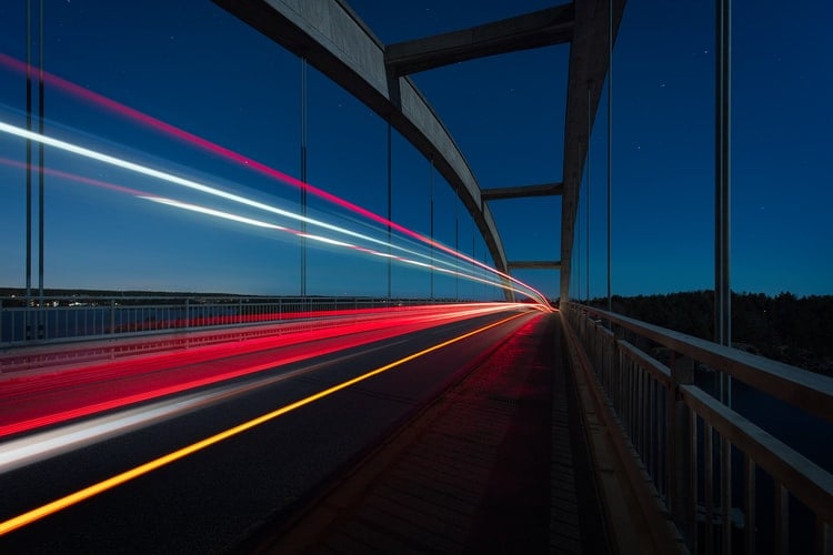 highway car lights on bridge